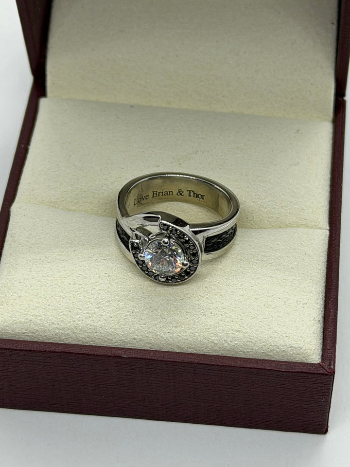 horseshoe ring with woven horsehair black diamonds and large center diamond on cream background showing engraving inside ring