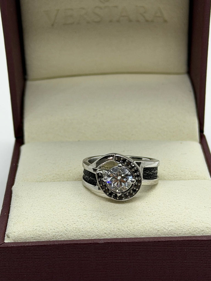 horseshoe ring with woven horsehair black diamonds and large center diamond on cream background