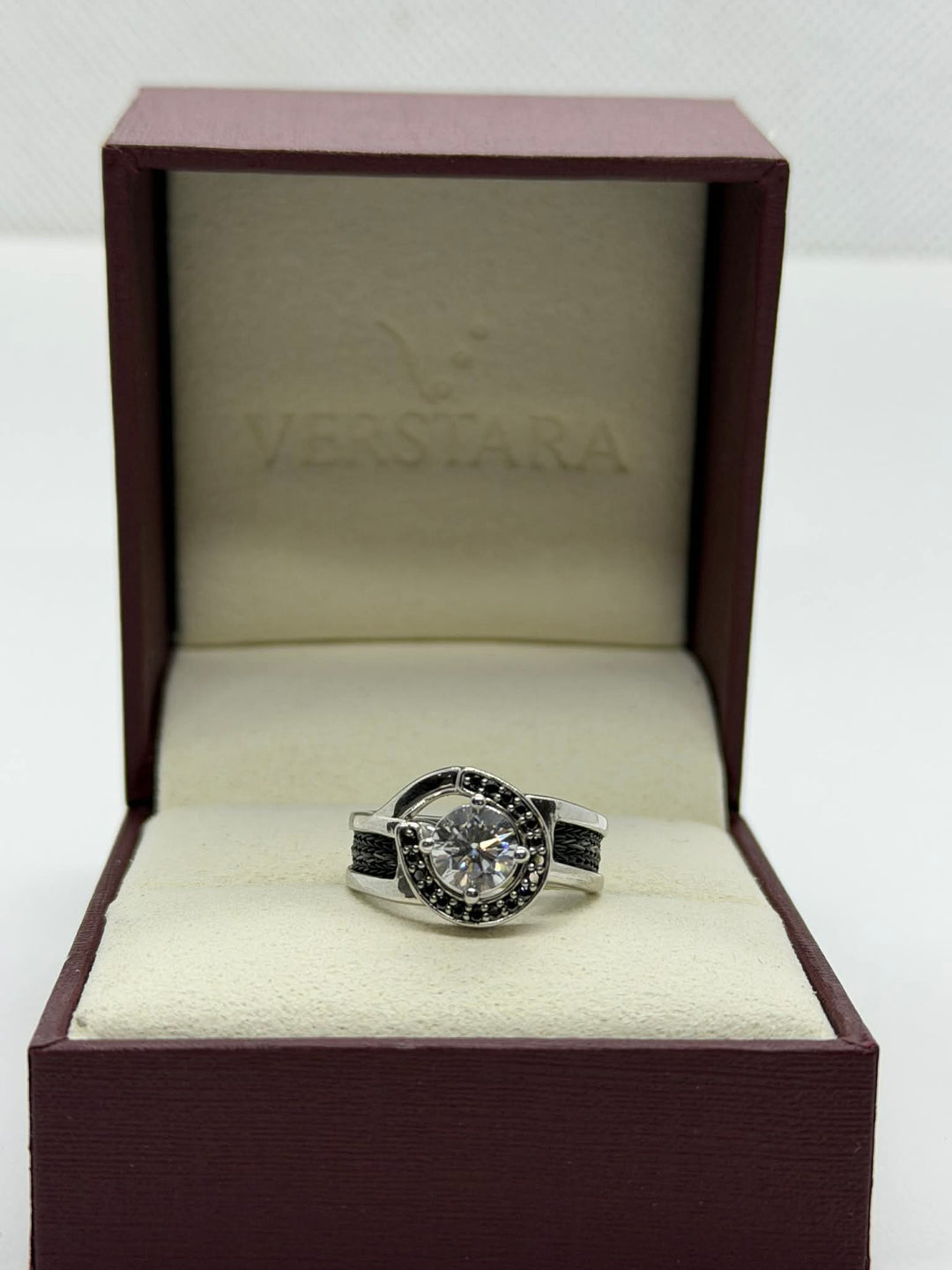 horseshoe ring with woven horsehair black diamonds and large center diamond on verstara branded gift box
