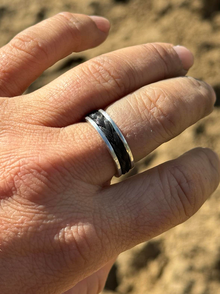 Model wearing Artisan custom horse hair memorial ring in sterling silver