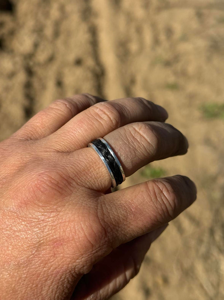 Model wearing Artisan custom horse hair memorial ring in sterling silver